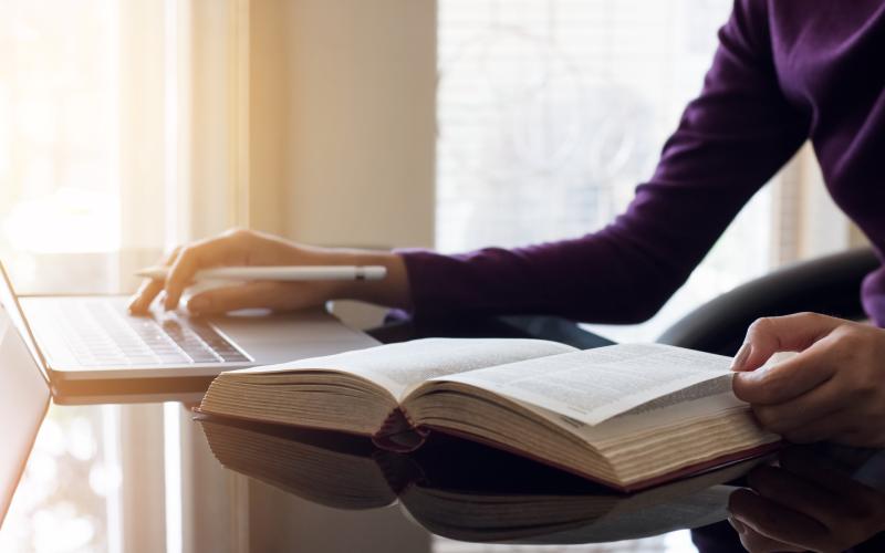 Dictionary and laptop is being used for translation