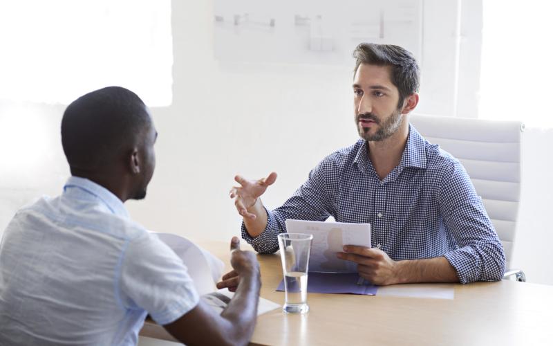 two men at the office having a conversation 